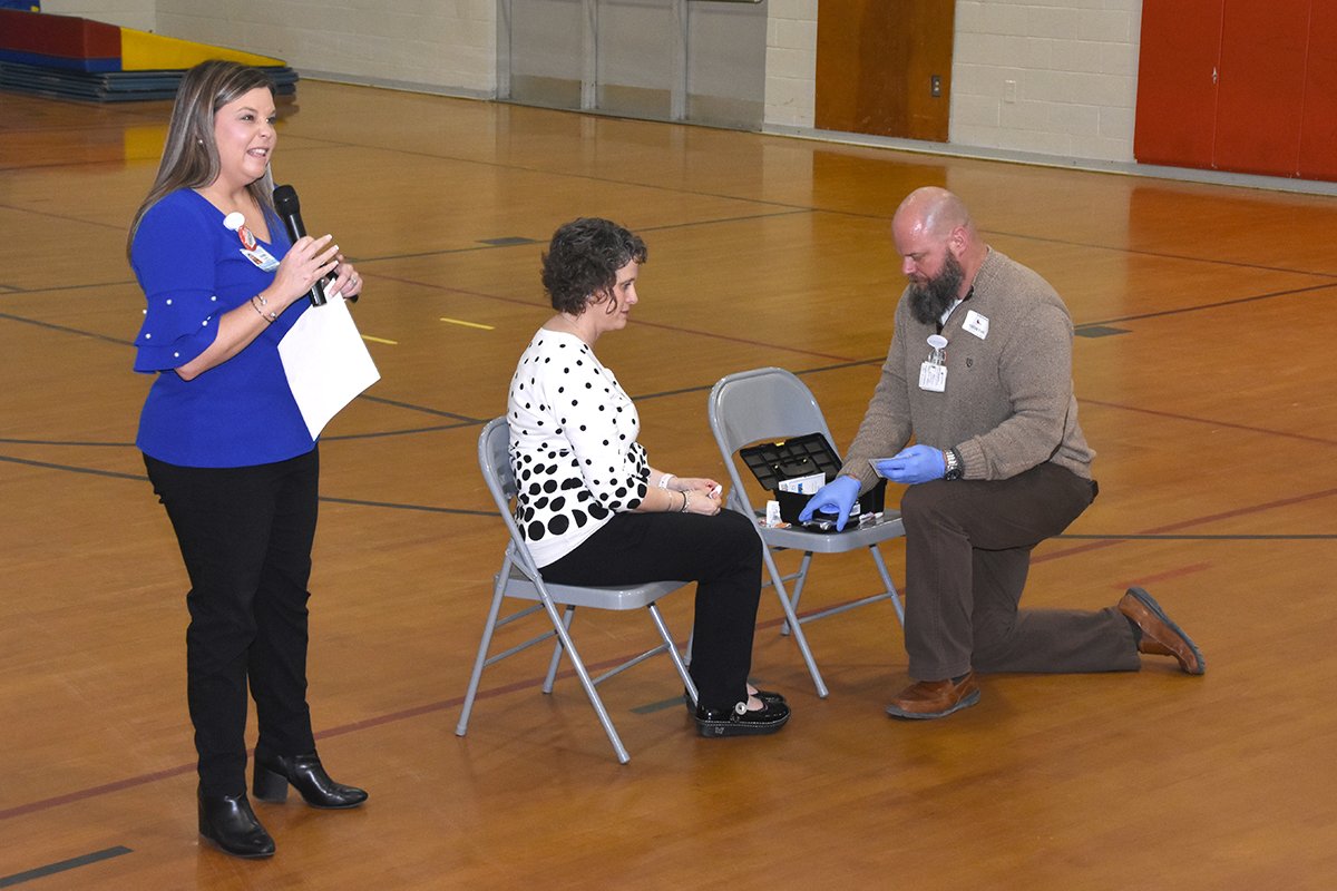 Four Oaks Elementary School Principal Kathy Parrish gets her blood checked