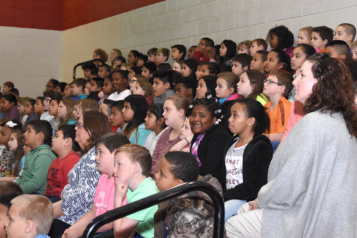 Jaime Pearce of Johnston Health’s WellnessWorks talks with school students at assembly