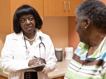 Doctor talks with patient.