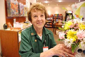 Lady with flowers in the gift shop