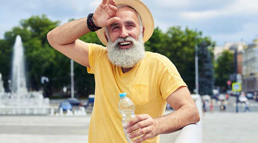 Man with a bottle of water.