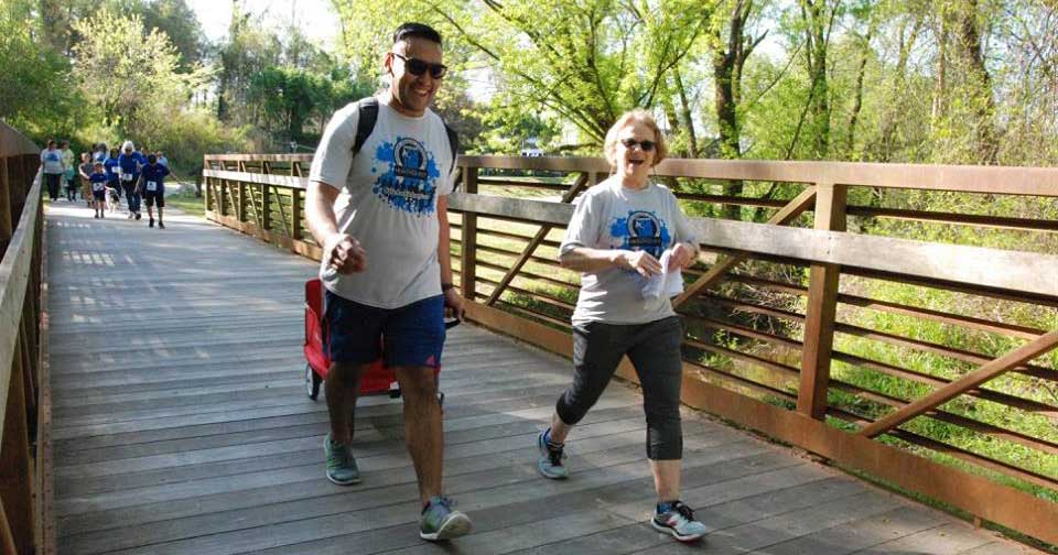 Walkers on bridge.