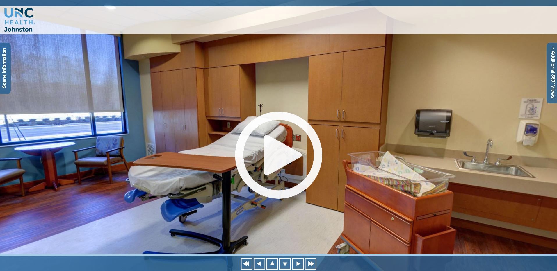 Delivery room with table, chairs, delivery bed, and bassinet