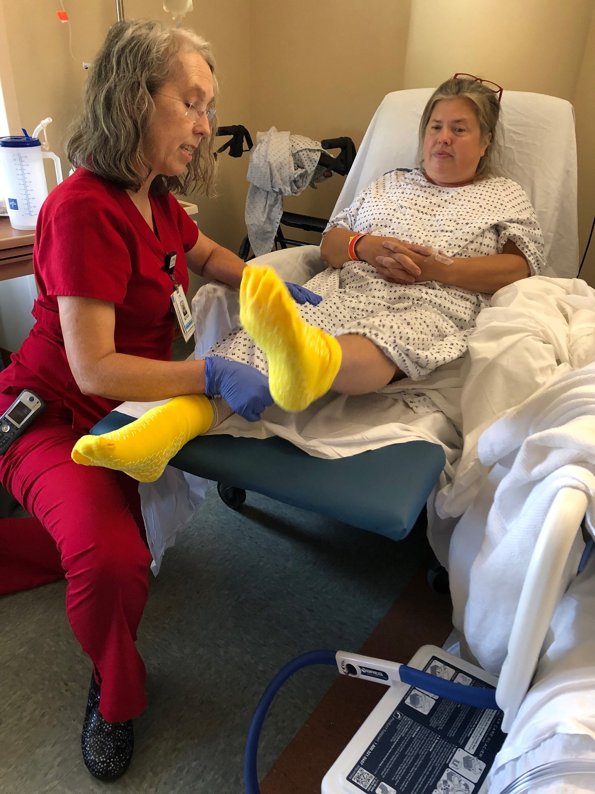 Patient receives physical therapy from a PT assistant after knee replacement